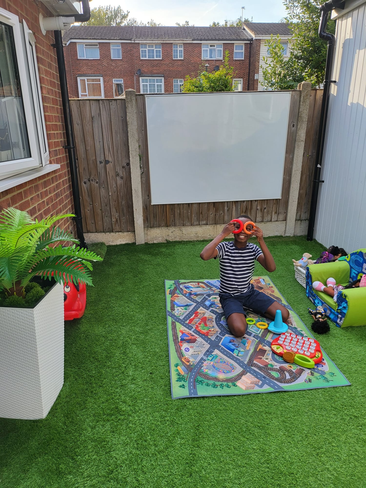 Toddler playing with colourful building blocks
